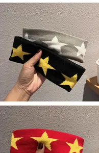 Close-up of knitted star headbands in black, grey, and red with soft woven textures