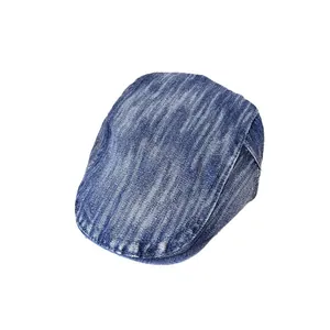 Vintage blue washed denim flat cap with retro distressed texture on white background
