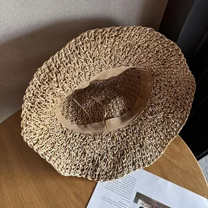 Foldable wide brim straw sun hat with adjustable inner strap for beach vacation