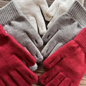 Detail of knitted gloves featuring convenient fingertip openings for touchscreen use