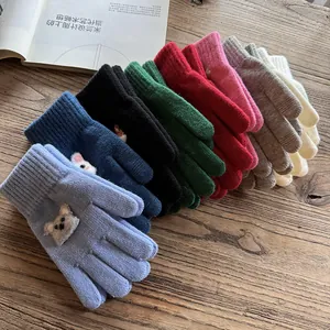 Detailed fan-shaped layout of colorful knitted gloves with cute 3D animal patches