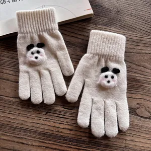 Detailed view of cream knitted gloves featuring 3D panda motifs and ribbed cuffs