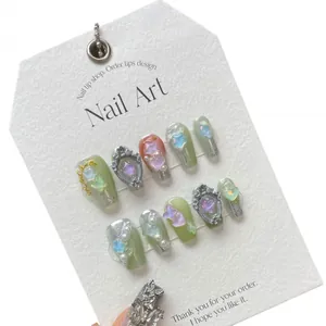 Handmade 3D heart and pearl press-on nails in sage green and silver glitter design