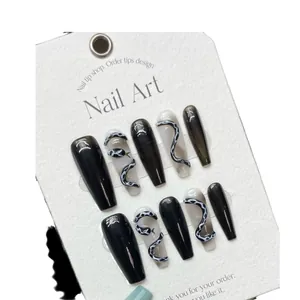 Handmade black 3D snake pattern press-on nails in long coffin shape for nail art