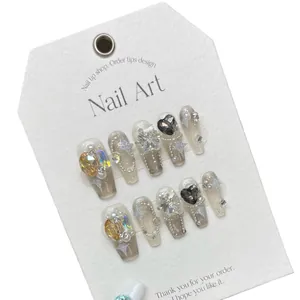 Handmade nail tips with translucent grey galaxy design, star gems and luxury pearls