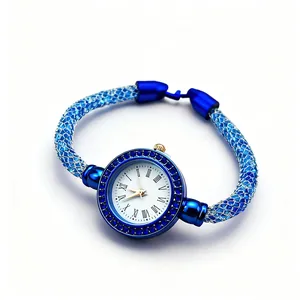 Elegant blue mesh strap women's watch with crystal bezel and Roman numeral dial