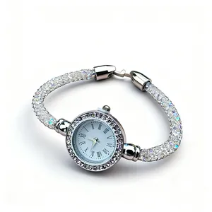Elegant silver quartz watch for women with rhinestone-filled mesh strap and roman numerals