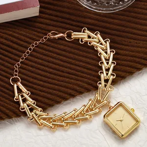 Detail of vintage gold square watch with unique I-shaped chain link strap and lobster clasp