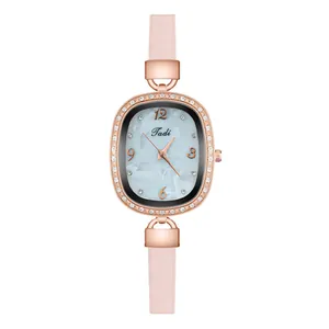Close-up of oval rose gold watch case with diamond inlay and blue marble dial