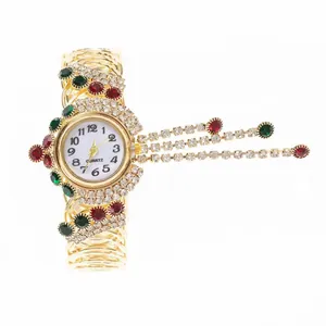 Vintage gold quartz watch for women with colorful crystals and fringe tassel details