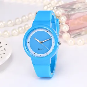 Close-up of a sky blue quartz watch with silicone strap on a refined decorative background