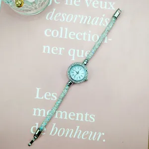 Macro view of crystal-filled mesh watch strap with sparkling silver rhinestone details