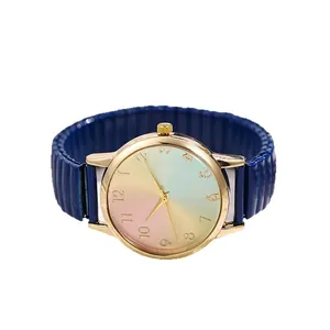 Women's quartz watch with rainbow dial and dark blue elastic stretch band in gold case