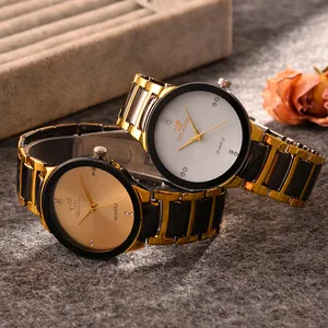 Detail of ORLANDO quartz watches featuring diamond-set dials and two-tone metal straps
