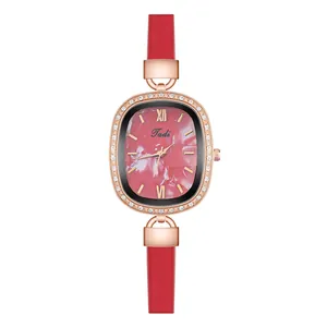 Detailed view of women's quartz watch with pink marble dial and rose gold rhinestone bezel