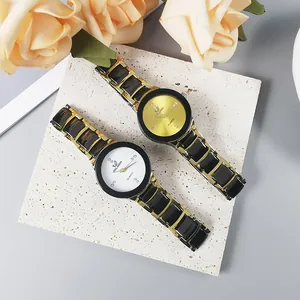 Detailed macro view of two luxury Orlando gold quartz watches with rhinestone markers