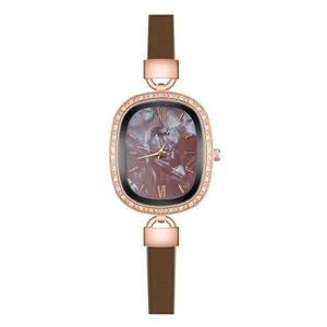 Detailed macro view of the rose gold oval case with crystal inlay and marble dial