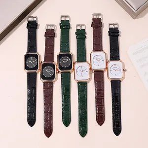 Flat lay of multiple square rose gold quartz watches with textured leather straps in various colors