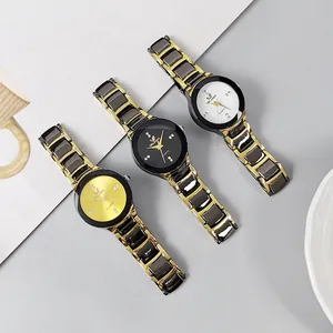 Close-up of stylish quartz watches with crystal markers and bicolor alloy steel bands
