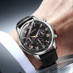 Close-up of a men's business watch with black leather strap and silver metal case