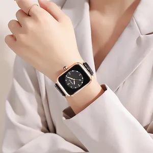Detail of elegant square ladies watch with black leather strap and rose gold metal case