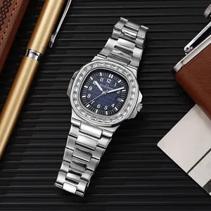 Detail shot of luxury men's watch with blue dial and crystal bezel on a leather desk mat