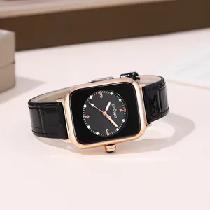 Detail of vintage square quartz watch with rose gold case and black leather strap