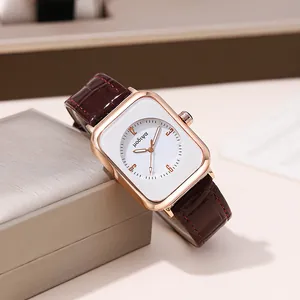 Close-up of a ladies' square quartz watch with rose gold case and brown leather band