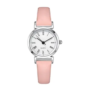 Minimalist women's quartz watch with small silver case, roman numerals and pink leather strap