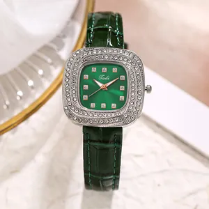 Close-up of Tadi green dial watch with rhinestone bezel and emerald leather strap