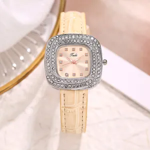 Detailed view of women's quartz watch with crystal bezel and faux crocodile leather strap