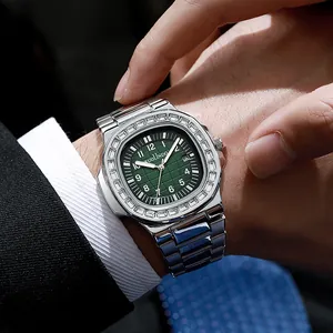 Detailed macro of a luxury steel watch with green dial and baguette zircon bezel