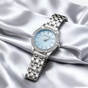 Detail of light blue sunray dial with crystal-encrusted bezel and silver stainless steel strap