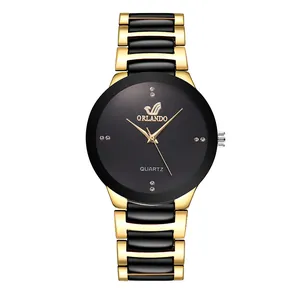Reloj de cuarzo para mujer en metal dorado y negro con elegantes detalles de diamantes