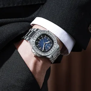 Detail of luxury men's steel watch with blue dial and diamond-set bezel on wrist