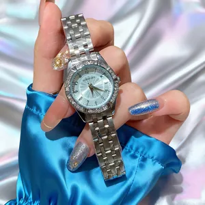 Detailed shot of lady's silver watch with iced blue dial and crystal-studded bezel