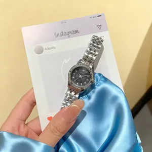 Detail view of OURSTART ladies watch featuring a diamond-set bezel and silver metal strap