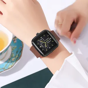 Close-up of elegant square dial watch with brown strap on wrist in lifestyle setting