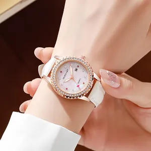 Montre femme or rose avec diamants brillants, bracelet cuir blanc et dateur intégré