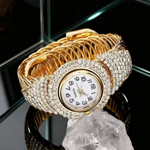Luxurious gold-tone quartz bracelet watch for women with full crystal accents and white dial