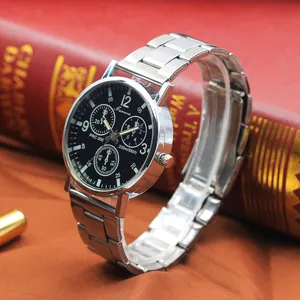 Men's silver stainless steel business watch with black chronograph dial on vintage book