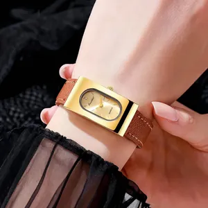 Vintage rectangular gold ladies watch with brown leather strap on wrist