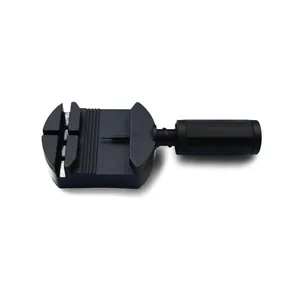 Close-up of black plastic watch band adjustment tool with screw handle on white background