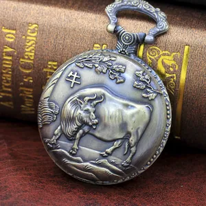 Close-up of vintage bronze pocket watch with 3D zodiac ox engraving on cover