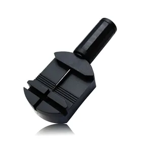 Black plastic watch band link remover tool for strap length adjustment on white background