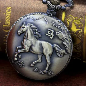 Detail of vintage bronze pocket watch featuring a horse relief and Chinese character