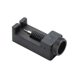 Detail view of the black plastic watch band link remover tool with metal punch pin