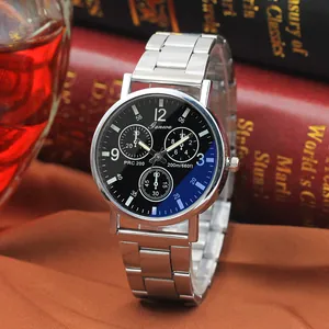 Detail of silver stainless steel chronograph watch on classic leather book and silk