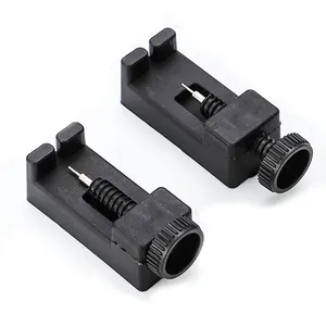 Close-up of black plastic watch band link remover tools for strap length adjustment