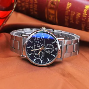 Detailed close-up of a men's quartz chronograph watch featuring a blue dial and steel strap
